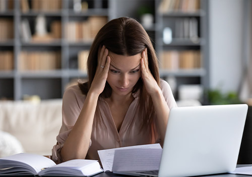 Woman Stressed From Expensive Medical Bills
